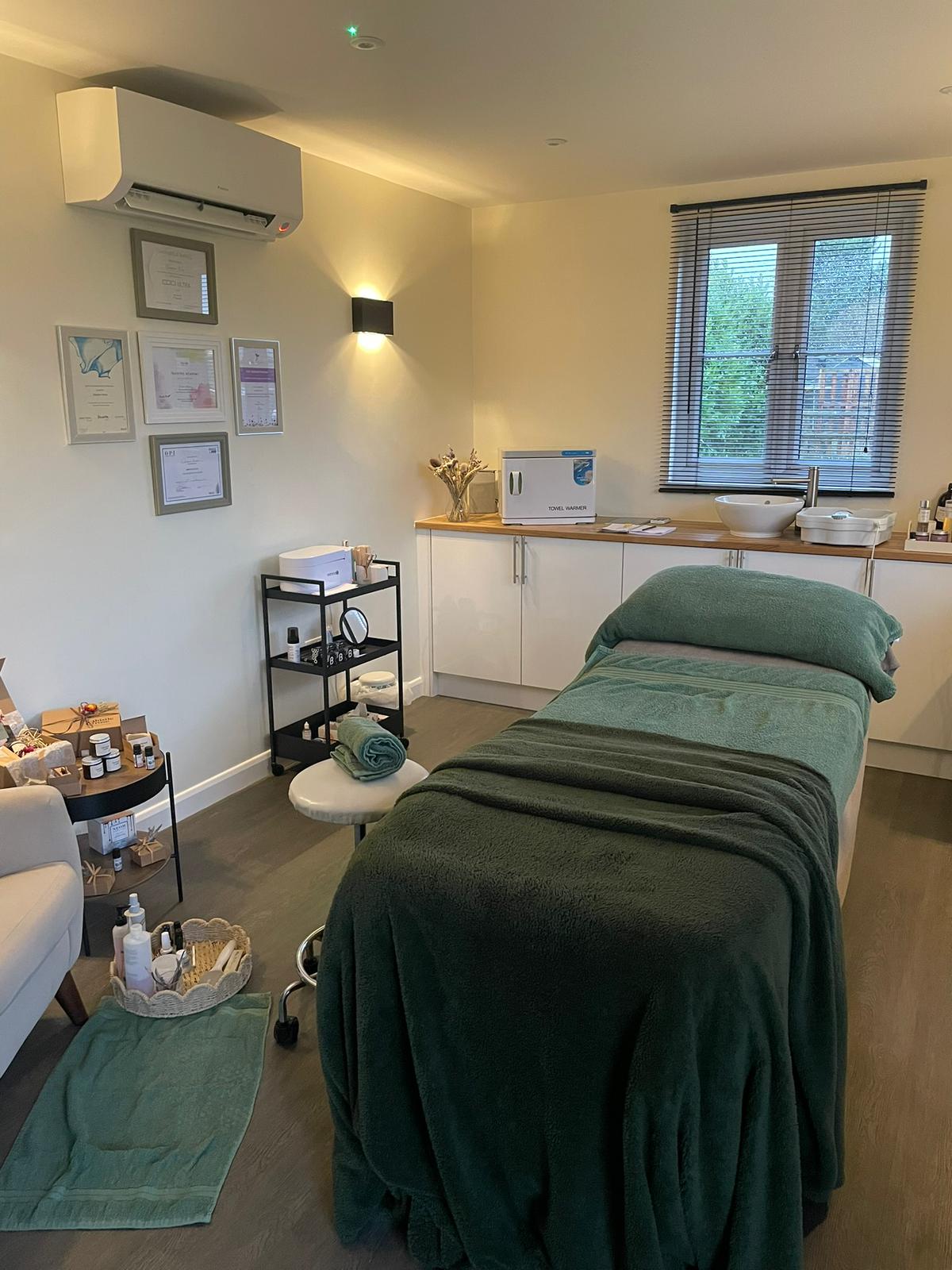 Massage couch and calming lighting at Lavender Barn